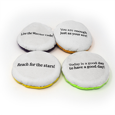 A selection of custom school Flop Balls featuring positive character traits.