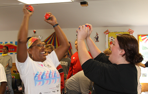 School teachers celebrating juggling success as part of professional development program.